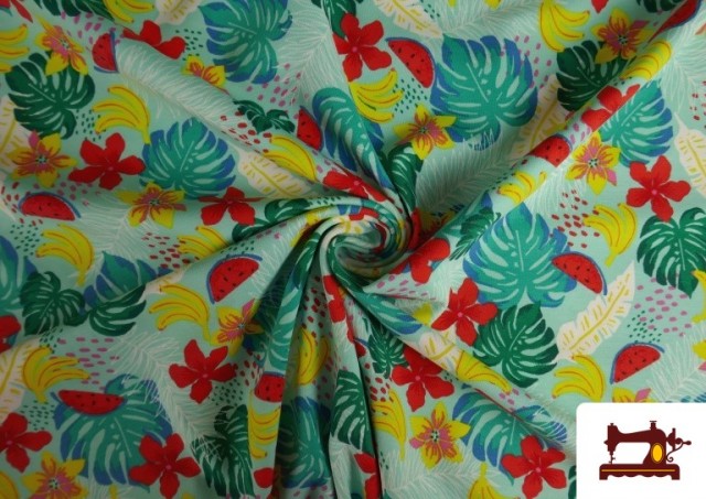 Acheter en ligne Tissu de Tee-Shirt Imprimé avec Feuilles Tropicales couleur Bleu turquoise