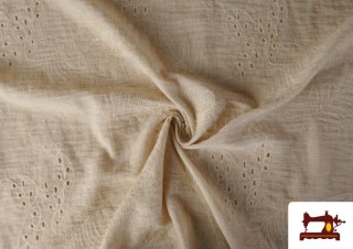 Tissu en lin brodé ajouré beige